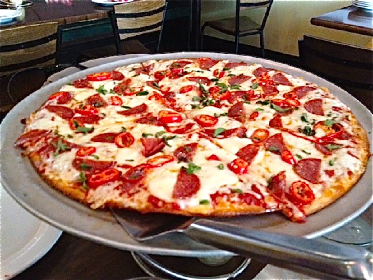 a pizza sitting on top of a table